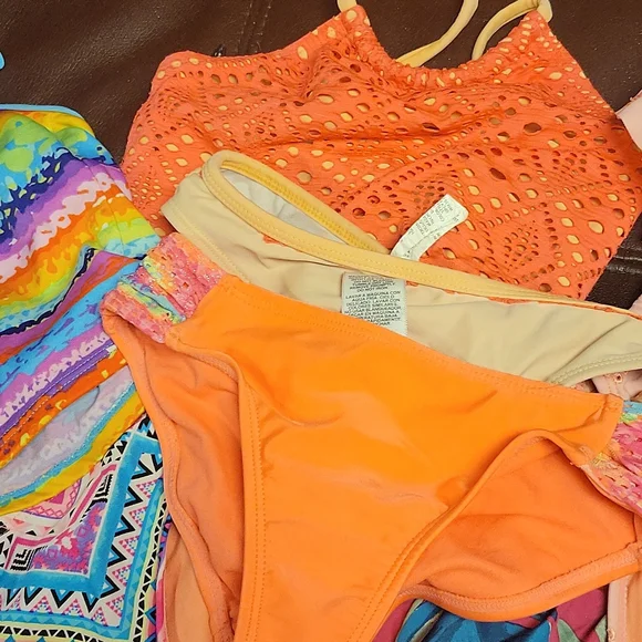 Three bikinis size 6-7 with suze 8 shorts